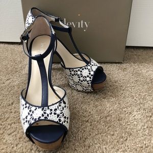 Levity used lace  white and navy shoes